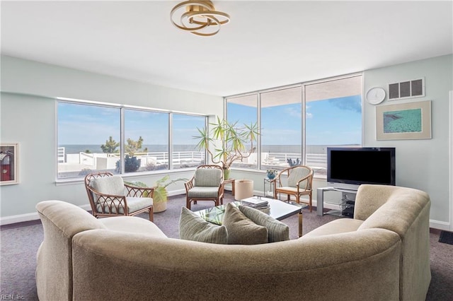 living room with visible vents and baseboards