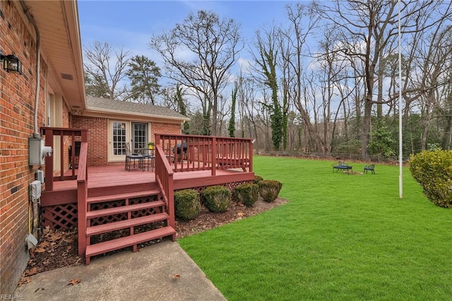 view of yard with a wooden deck