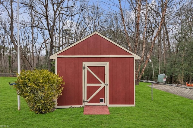 view of shed with fence