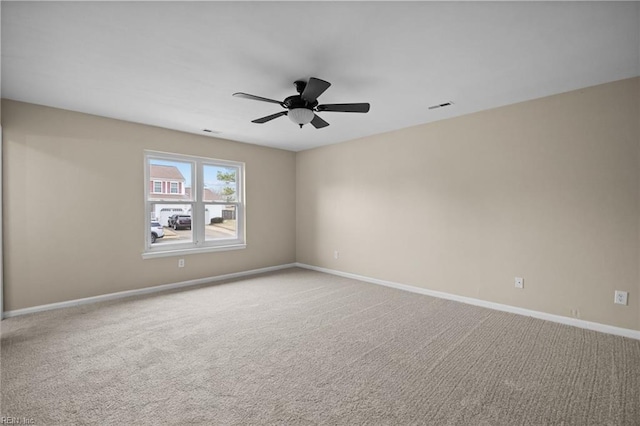 unfurnished room featuring a ceiling fan, baseboards, visible vents, and carpet flooring