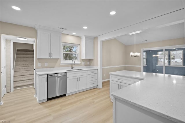 kitchen with recessed lighting, stainless steel dishwasher, light wood-style floors, white cabinetry, and a sink