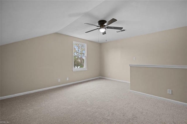 additional living space featuring carpet floors, baseboards, visible vents, and vaulted ceiling