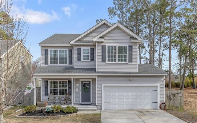 view of front of house featuring a porch, concrete driveway, roof with shingles, and fence