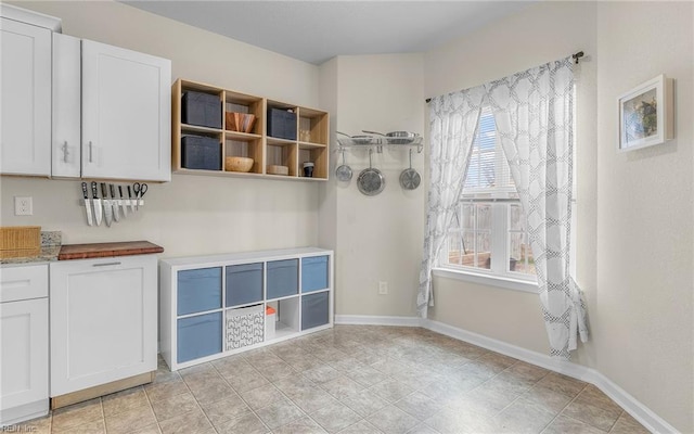 interior space featuring baseboards