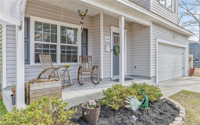 doorway to property featuring a porch and driveway