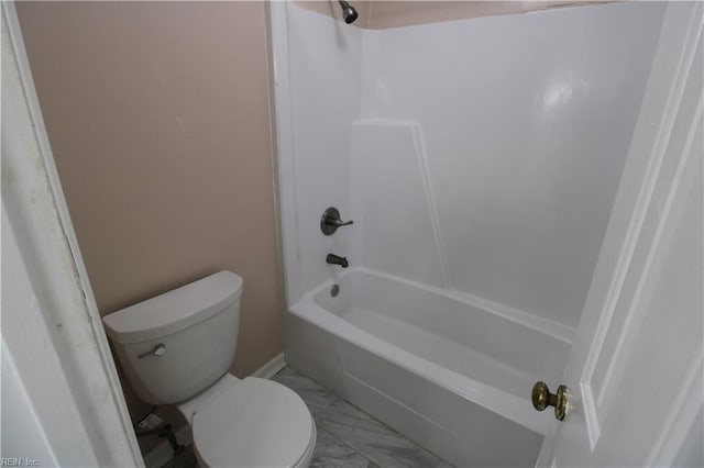 full bath featuring marble finish floor, shower / bathing tub combination, and toilet