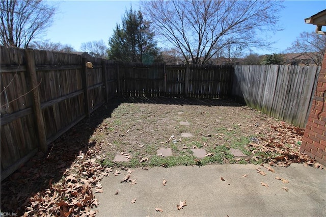 view of yard with a fenced backyard