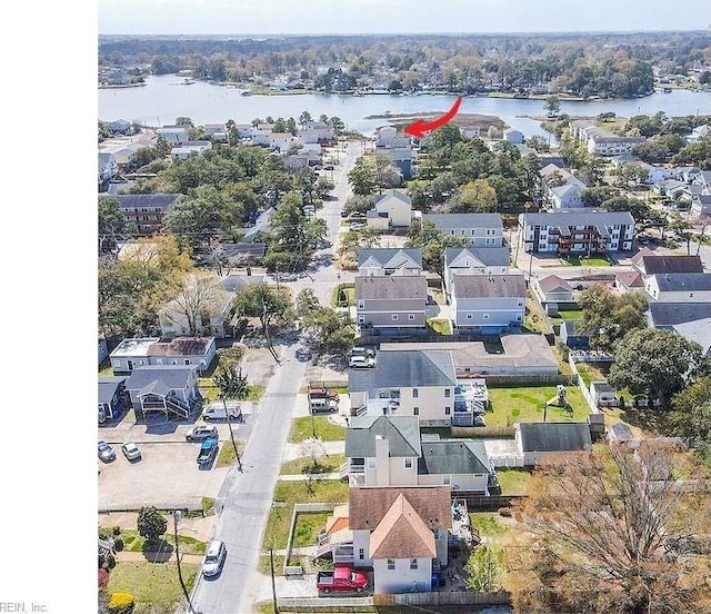 bird's eye view featuring a residential view and a water view