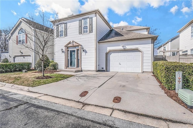 view of front facade with concrete driveway and an attached garage