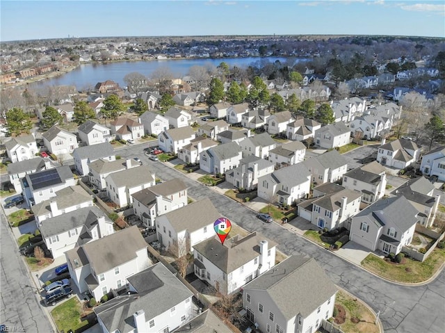 bird's eye view with a residential view and a water view