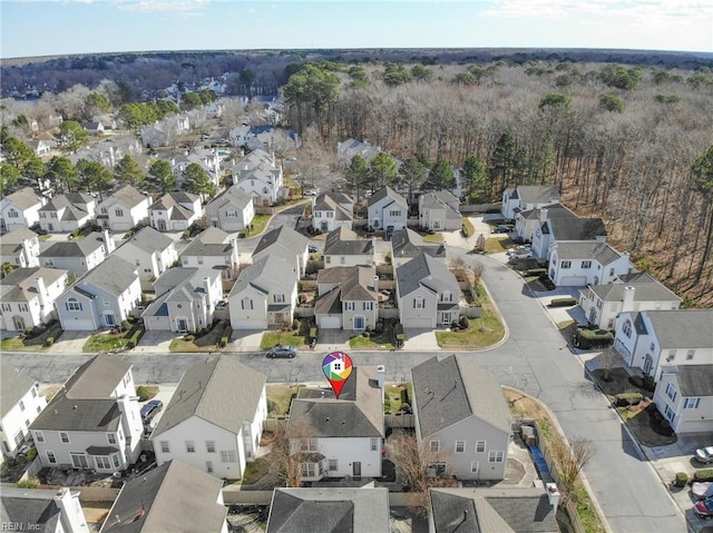 birds eye view of property with a residential view