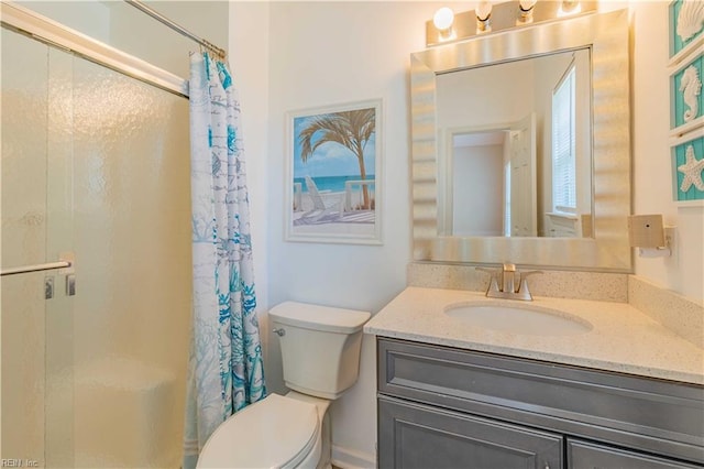 bathroom with toilet, curtained shower, and vanity