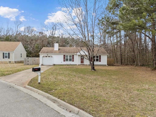 ranch-style home featuring concrete driveway, a chimney, an attached garage, fence, and a front yard