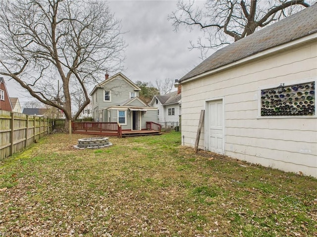 view of yard with fence and a deck