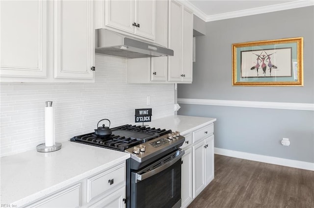 kitchen featuring ornamental molding, under cabinet range hood, white cabinets, decorative backsplash, and stainless steel range with gas stovetop