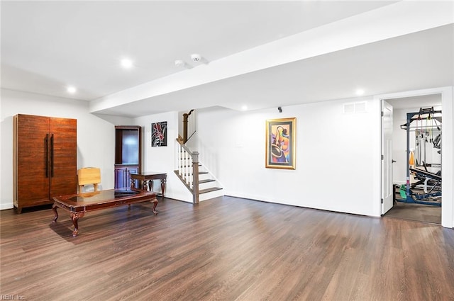 sitting room with recessed lighting, visible vents, wood finished floors, and stairs