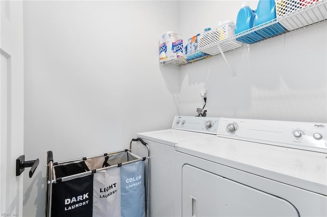 washroom with laundry area and washer and clothes dryer