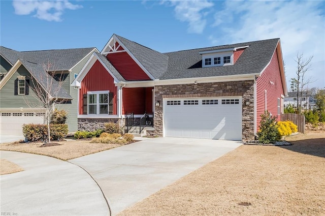 craftsman inspired home with board and batten siding, concrete driveway, an attached garage, and stone siding