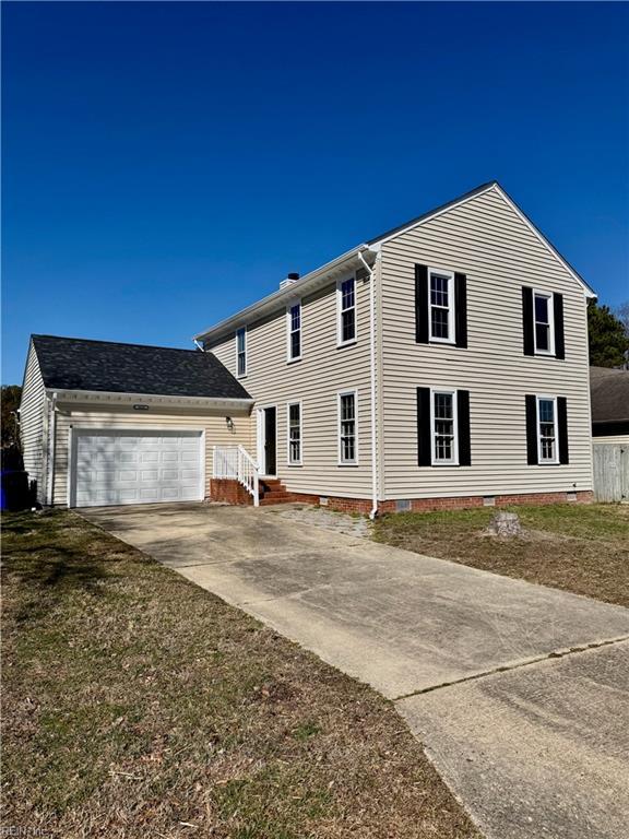 view of front facade with crawl space, a garage, and concrete driveway