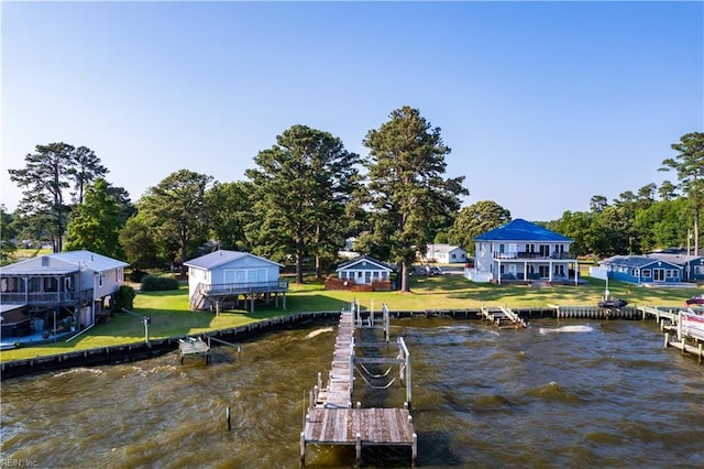 view of dock featuring a water view and a lawn