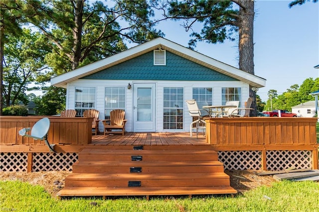 back of house with a wooden deck