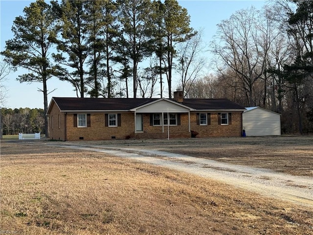 single story home featuring crawl space, a chimney, and brick siding