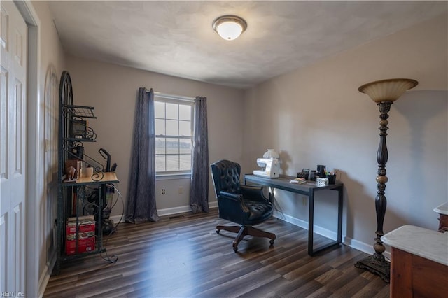 office space with baseboards and dark wood-type flooring