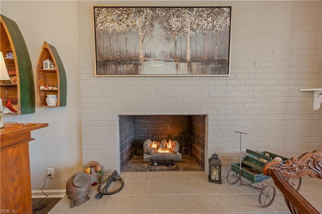 interior details with a fireplace and baseboards