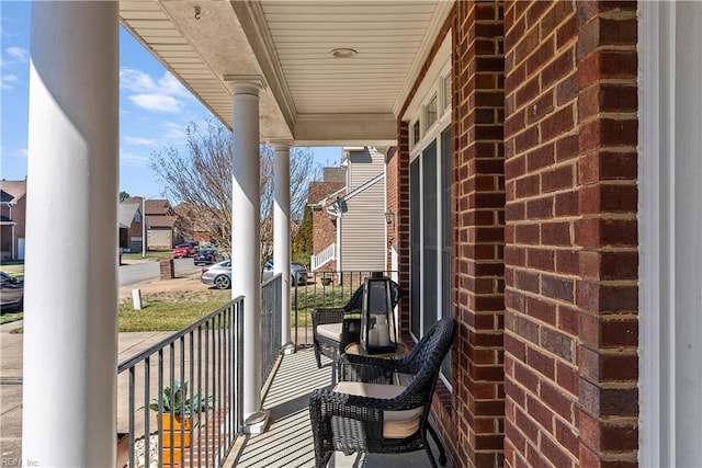 balcony with a residential view and covered porch