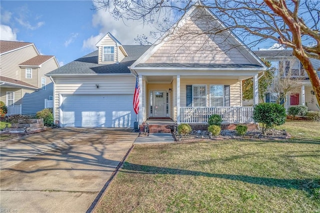 view of front facade featuring an attached garage, covered porch, driveway, roof with shingles, and a front yard