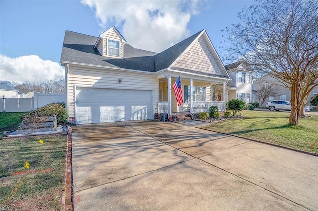 view of front facade featuring covered porch, a front yard, fence, a garage, and driveway