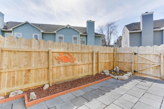 exterior space with fence and a gate