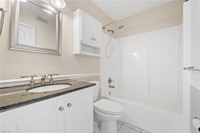 bathroom featuring toilet, visible vents, bathing tub / shower combination, vanity, and tile patterned floors