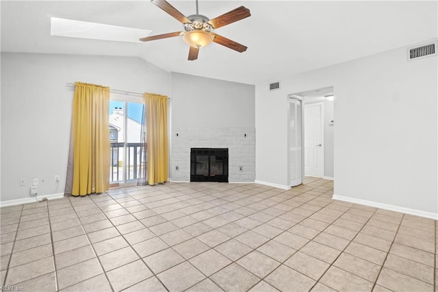 unfurnished living room featuring lofted ceiling, ceiling fan, a fireplace, and visible vents