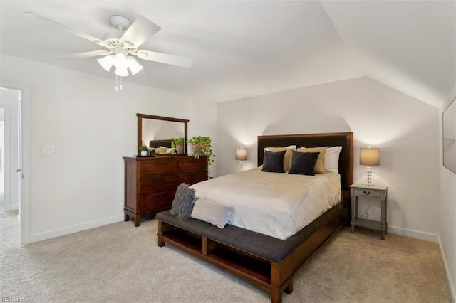 bedroom featuring ceiling fan, baseboards, vaulted ceiling, and light colored carpet