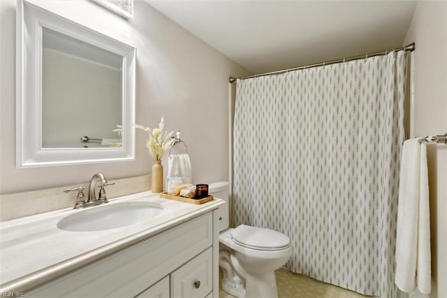 full bath featuring toilet and vanity