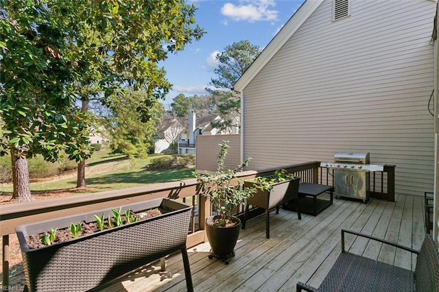 wooden deck featuring grilling area