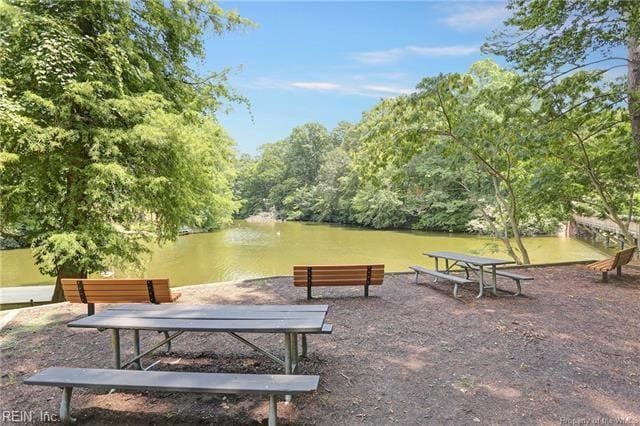 surrounding community featuring a water view