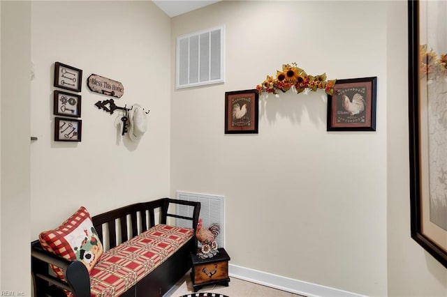 bedroom featuring tile patterned floors, baseboards, and visible vents