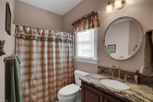 bathroom with backsplash, curtained shower, toilet, and vanity