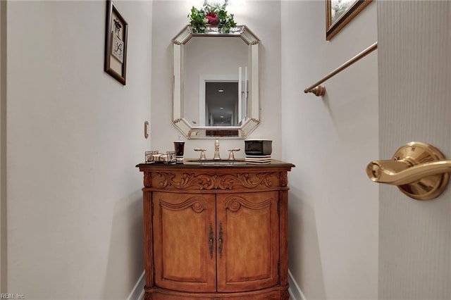 interior space with baseboards and vanity