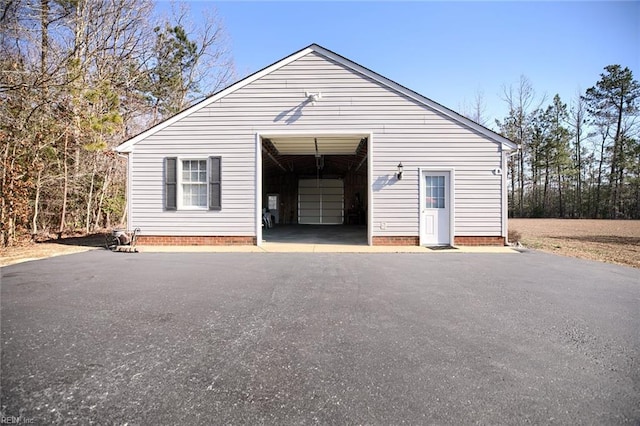 detached garage with aphalt driveway