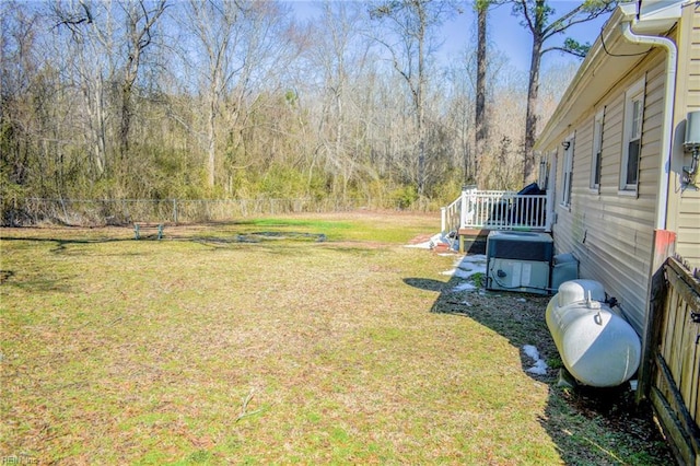 view of yard featuring cooling unit and fence