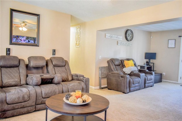 living room featuring light carpet and baseboards