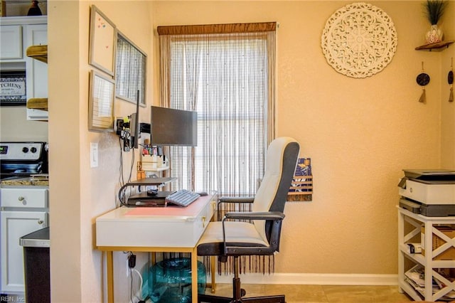 office with light tile patterned flooring and baseboards