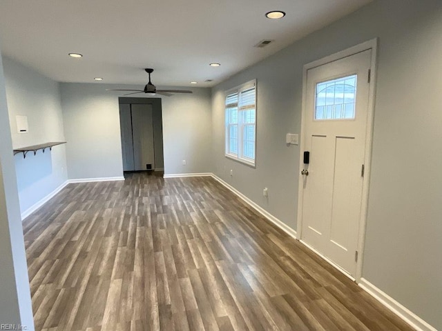 unfurnished living room featuring ceiling fan, baseboards, dark wood finished floors, and recessed lighting