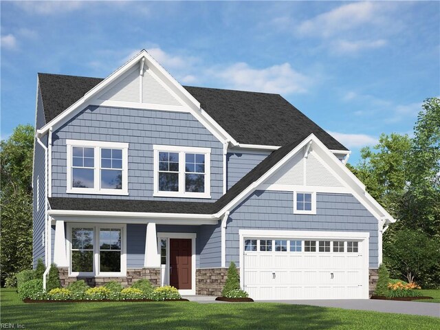 craftsman house featuring stone siding, driveway, and a front lawn