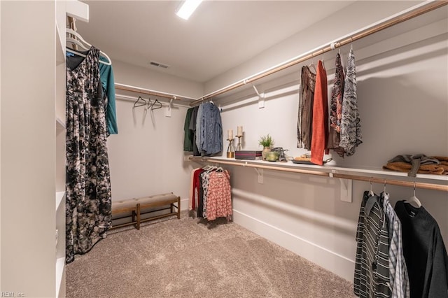 walk in closet with carpet floors and visible vents