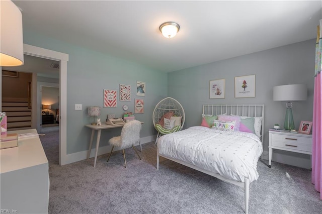 bedroom with carpet flooring, baseboards, and visible vents