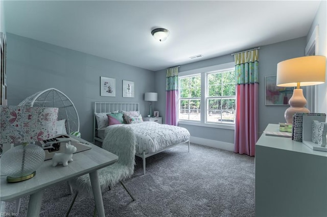 carpeted bedroom with baseboards and visible vents